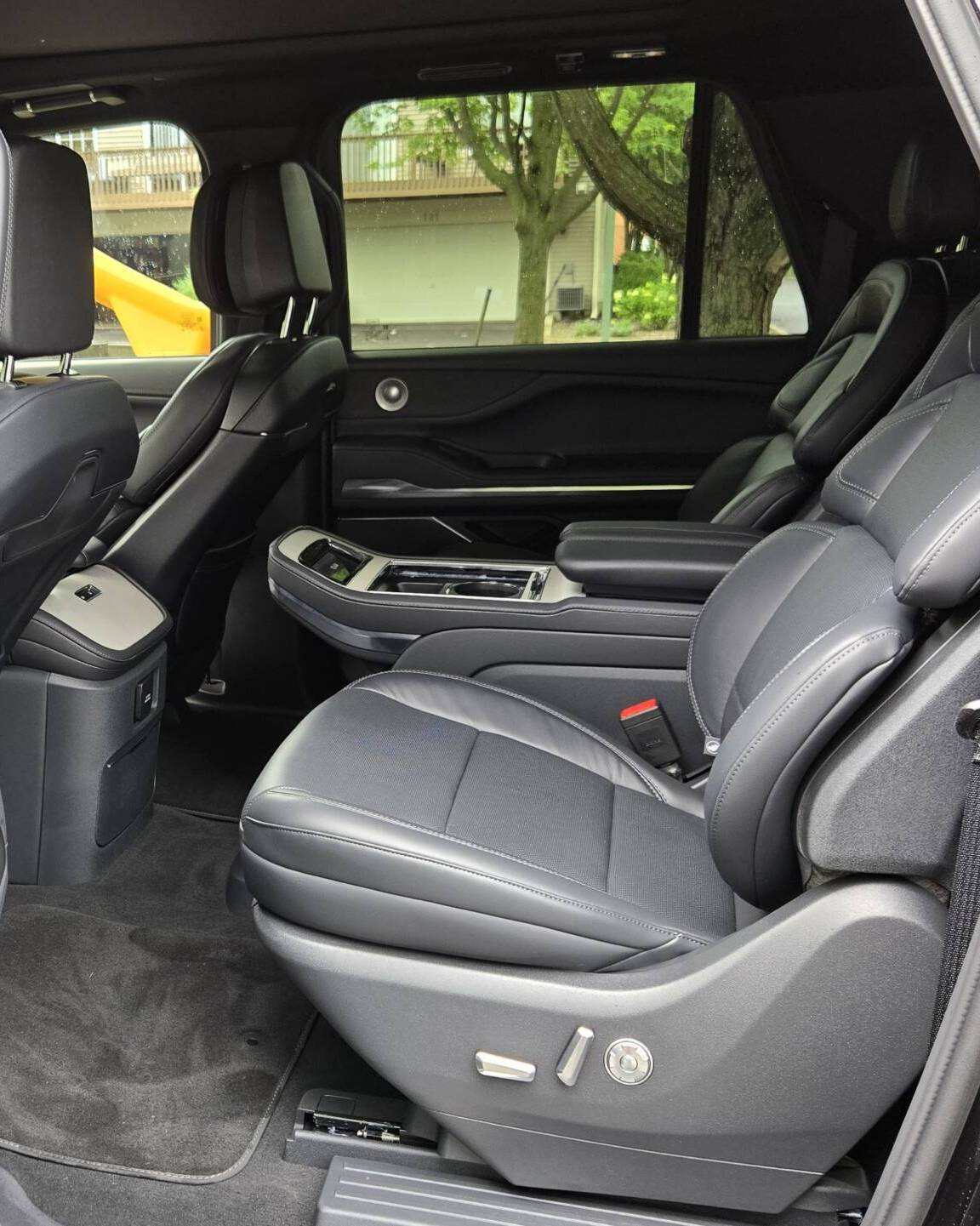 Rear interior view of the 2025 Lincoln Navigator L with captain’s chairs and luxury SUV comfort